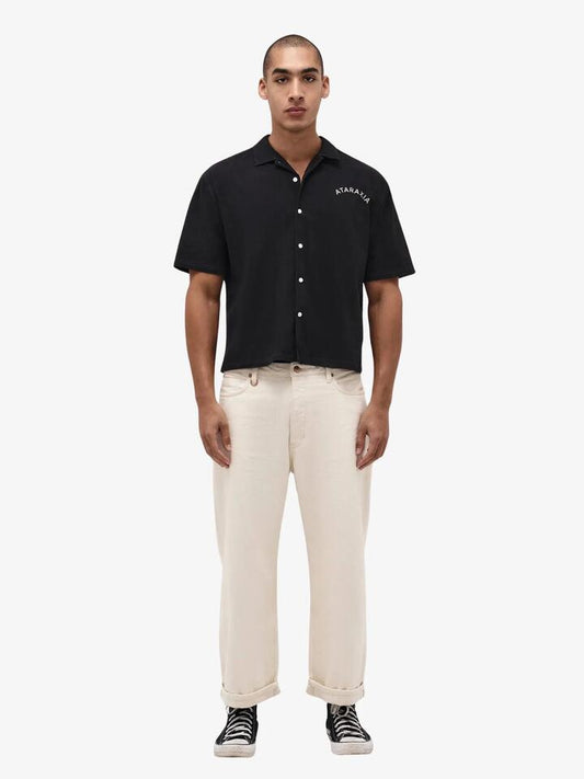 Image of a model wearing Shorts. Productname: Neuw Ataraxia Short Sleeve Mod Shirt in Black colour by brand - Neuw