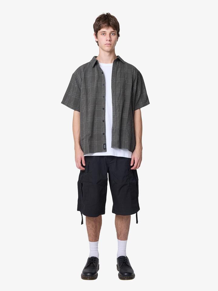 Image of a model wearing Shorts. Productname: Article One Flight Cargo Shorts in Black colour by brand - Article One