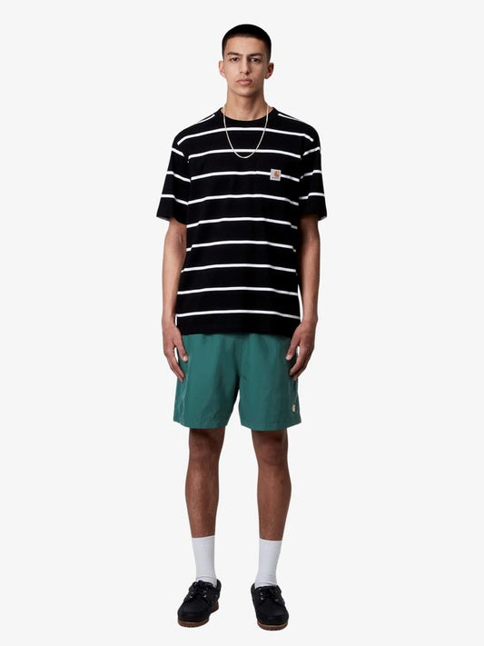 Image of a model wearing Shorts. Productname: Carhartt Wip Chase Swim Shorts - Rainforest/Gold in Rainforest/Gold colour by brand - Carhartt Wip