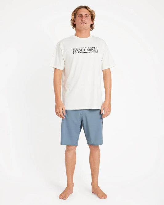 Image of a model wearing Shorts. Productname: Volcom - Mens Lido Solid Mod 20" Boardshort - Blue Wash - in Blue Wash colour by brand - Volcom