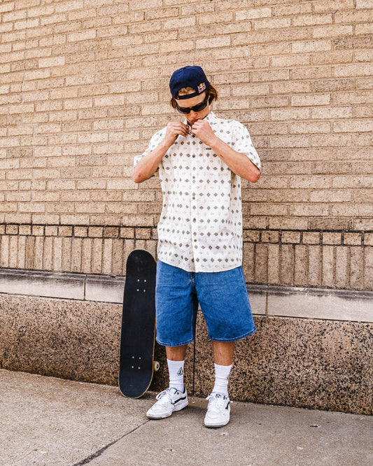 Image of a model wearing Shorts. Productname: Volcom - Mens Billow 22" Denim Shorts - Deep River Blues - in Deep River Blues colour by brand - Volcom