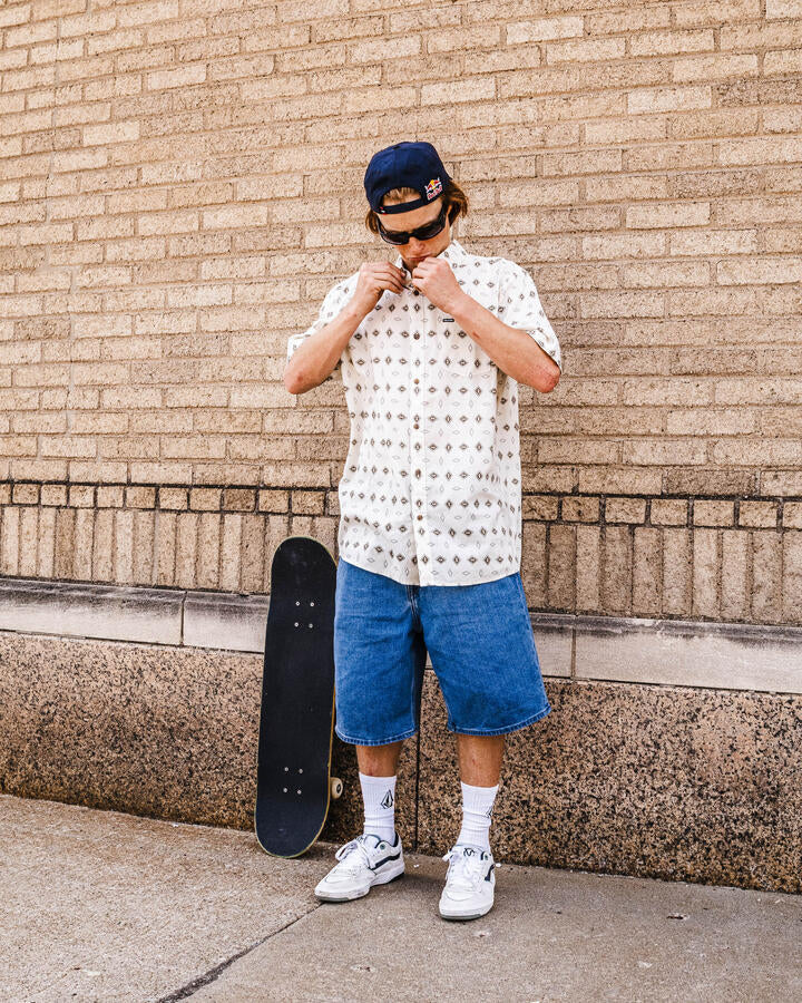 Image of a model wearing Shorts. Product name - Volcom Mens Billow 22" Denim Shorts Deep River Blues in Deep River Blues colour by brand - Volcom