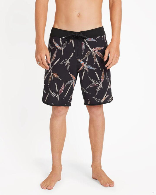 Image of a model wearing Shorts. Productname: Volcom - Mens Changeling Scallop Mod 19" Boardshort - Black - in Black colour by brand - Volcom