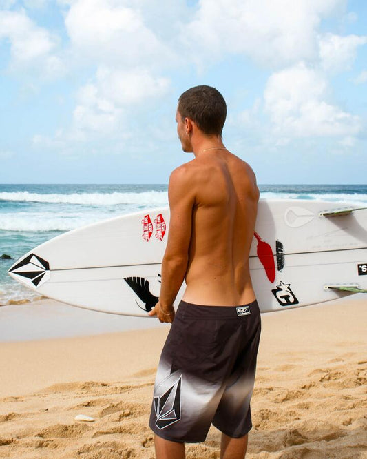 Image of a model wearing Shorts. Productname: Volcom Mens Vee Bee Mod 20" Boardshort Black Grey - in Black Grey colour by brand - Volcom
