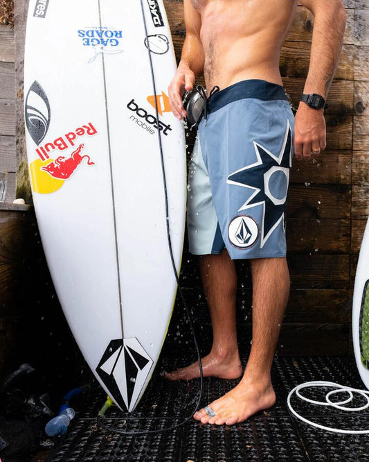 Image of a model wearing Shorts. Productname: Volcom - Mens St4R G4Zer Mod 20" Boardshort - Blue Wash - in Blue Wash colour by brand - Volcom