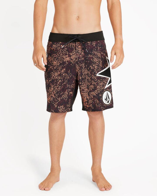 Image of a model wearing Shorts. Product name - Volcom Mens St4R G4Zer Mod 20" Boardshort Merlot in Merlot colour by brand - Volcom