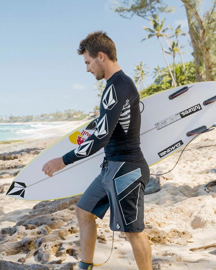 Image of a model wearing Shorts. Product name - Volcom Mens Team Mod 20" Boardshort Storm Cloud in Storm Cloud colour by brand - Volcom