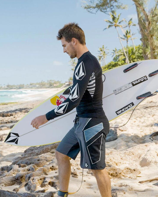 Image of a model wearing Shorts. Product name - Volcom Mens Team Mod 20" Boardshort Storm Cloud in Storm Cloud colour by brand - Volcom