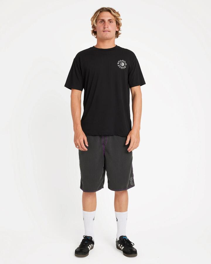 Image of a model wearing Shorts. Product name - Volcom Mens Off Ozzy Trunk 21" Swim Shorts Black in Black colour by brand - Volcom