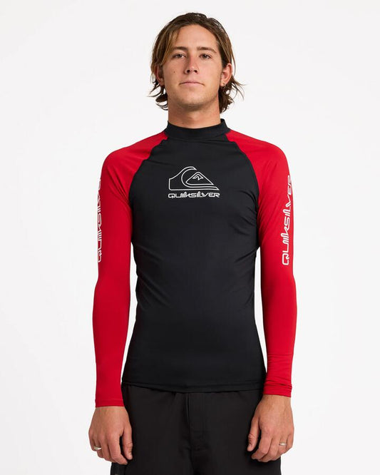 Image of a model wearing Tops. Productname: Quiksilver - Mens On Tour Long Sleeve Rash Vest - Salsa - in Salsa colour by brand - Quiksilver