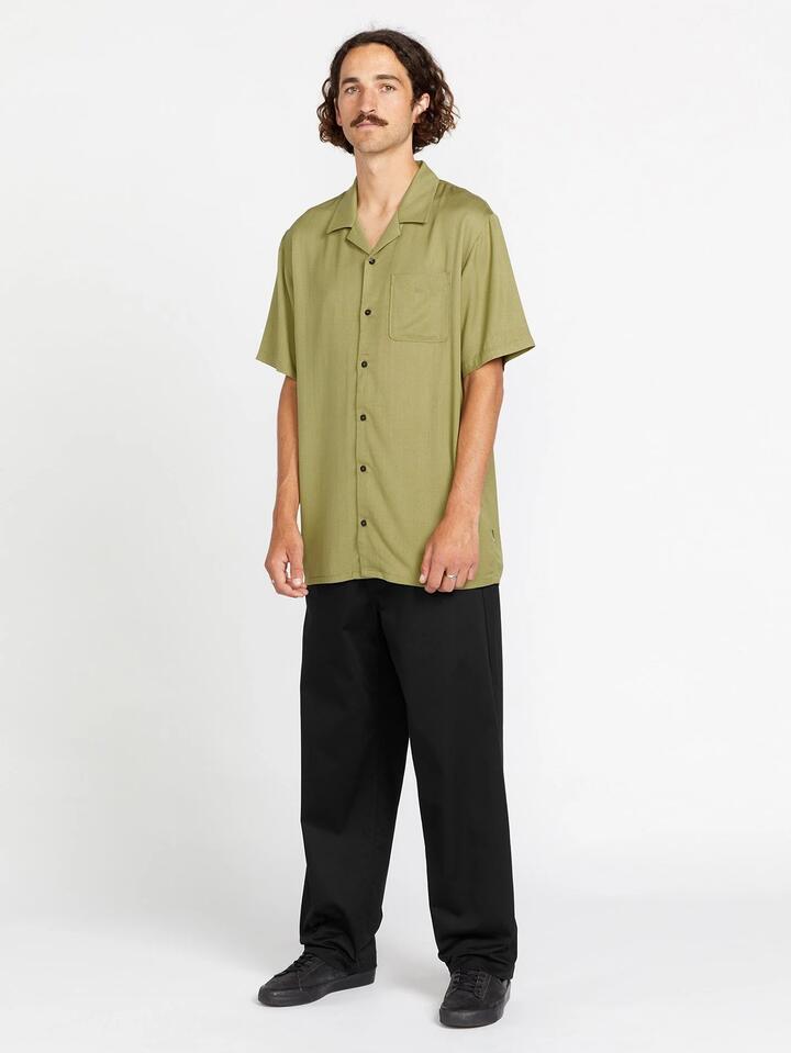 Image of a model wearing Tops. Productname: Volcom Mens Rakstone Short Sleeve Shirt Vintage Green - in Vintage Green colour by brand - Volcom