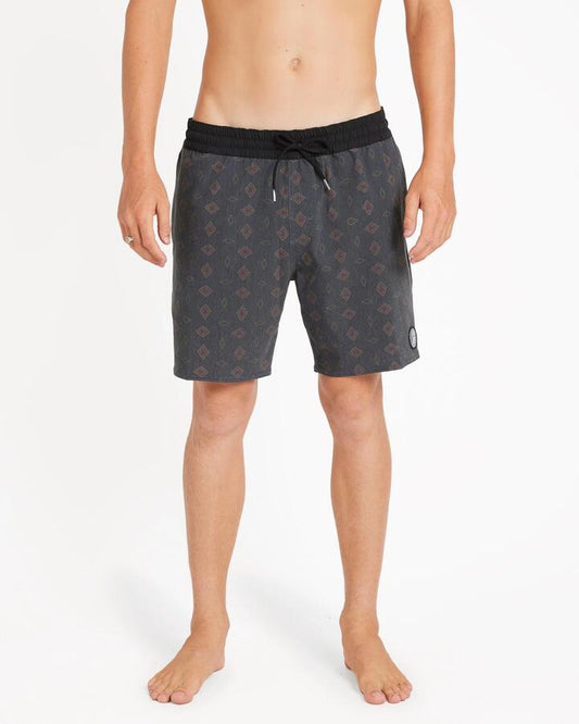 Image of a model wearing Shorts. Productname: Volcom - Mens Psych Cotton Trunk 17" Swim Shorts - Black - in Black colour by brand - Volcom