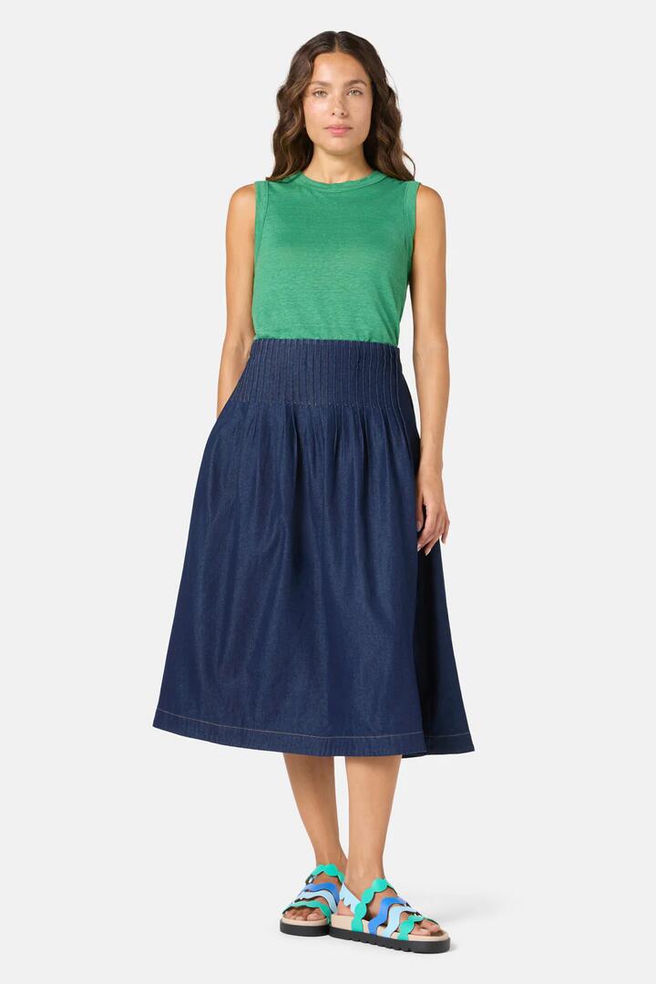 Image of a model wearing Skirts. Product name - Gabrielle Chambray Skirt in Indigo colour by brand - Gorman
