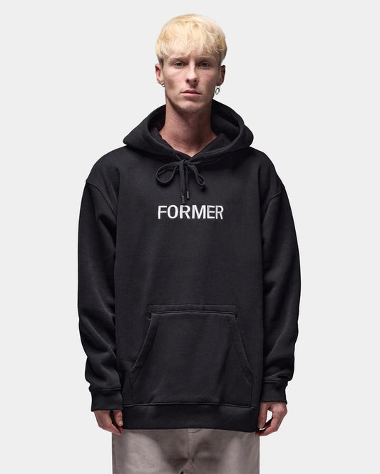 Image of a model wearing Outerwear. Productname: former - Mens Legacy Embroidery Pullover Hoodie - Black - in Black colour by brand - former