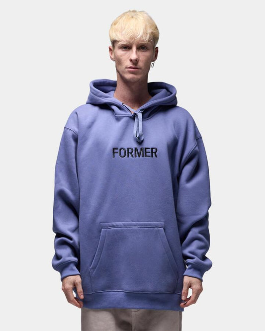 Image of a model wearing Outerwear. Product name - Former Mens Legacy Embroidery Pullover Hoodie Violet in Violet colour by brand - Former