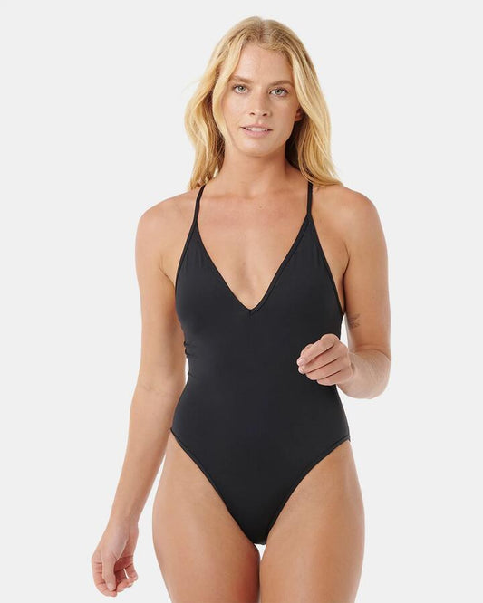 Image of a model wearing Tops. Productname: rip Curl - Womens Classic Surf One Piece - Black - in Black colour by brand - rip Curl