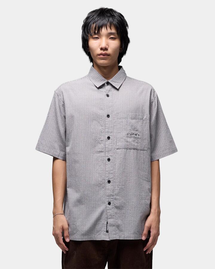 Image of a model wearing Tops. Productname: former Mens Vivian Check Short Sleeve Shirt Black - in Black colour by brand - Former