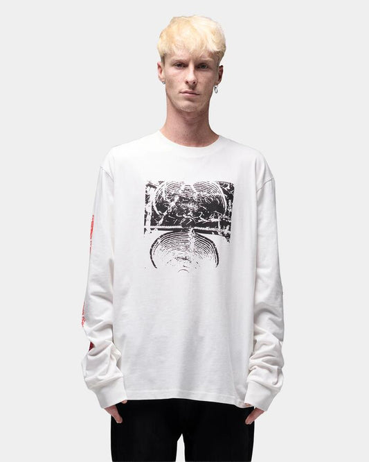 Image of a model wearing Tops. Productname: former Mens Ode Long Sleeve T-Shirt Oyster - in Oyster colour by brand - Former