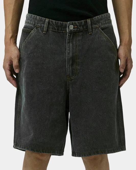 Image of a model wearing Shorts. Product name - Former Mens Reynolds 21" Denim Shorts Washed Black in Washed Black colour by brand - Former