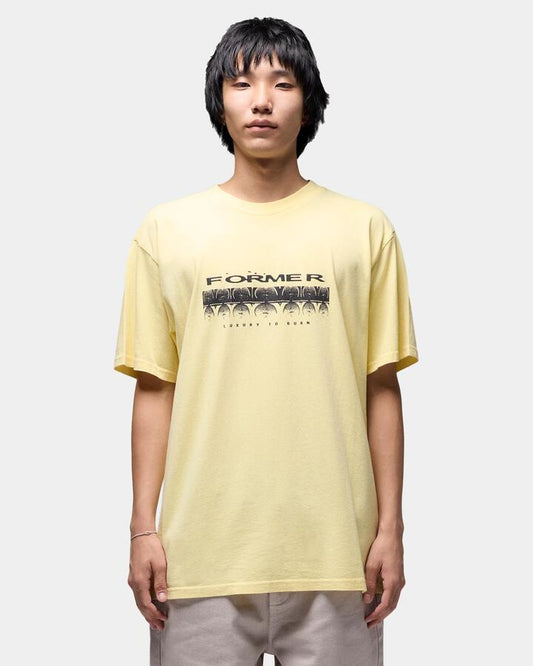 Image of a model wearing Tops. Productname: former Mens Quaver T-Shirt Flax - in Flax colour by brand - Former