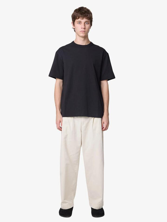 Image of a model wearing Pants. Productname: Article One Nano Pants in BONE colour by brand - Article One