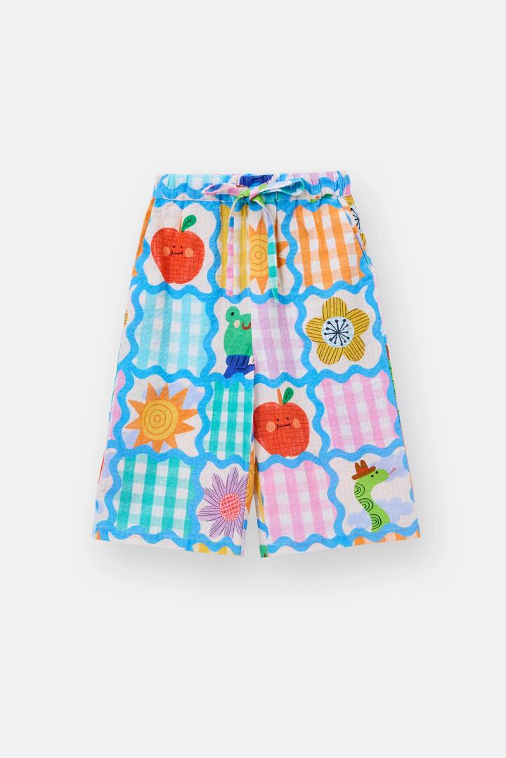 Image of a model wearing Pants. Product name - Jumble Check Kids Culotte Pants in Multi colour by brand - Gorman