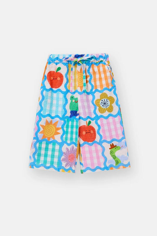 Image of a model wearing Pants. Product name - Jumble Check Kids Culotte Pants in Multi colour by brand - Gorman