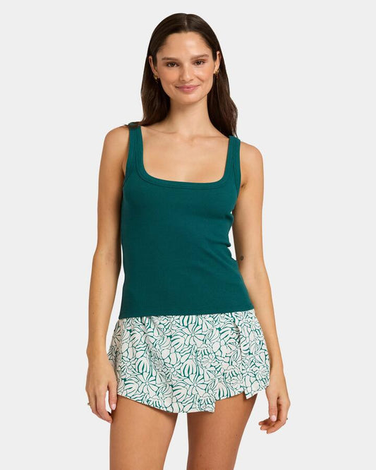 Image of a model wearing Tops. Productname: Nunui Womens Cornet Tank Deep Sea Green - in Deep Sea Green colour by brand - Nunui