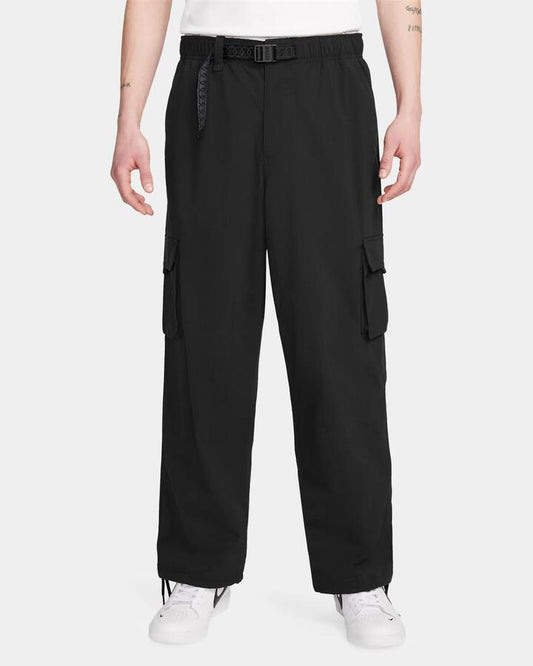Image of a model wearing Pants. Productname: nike Mens Sb Kearny Cargo Pants Black/White - in Black/White colour by brand - Nike