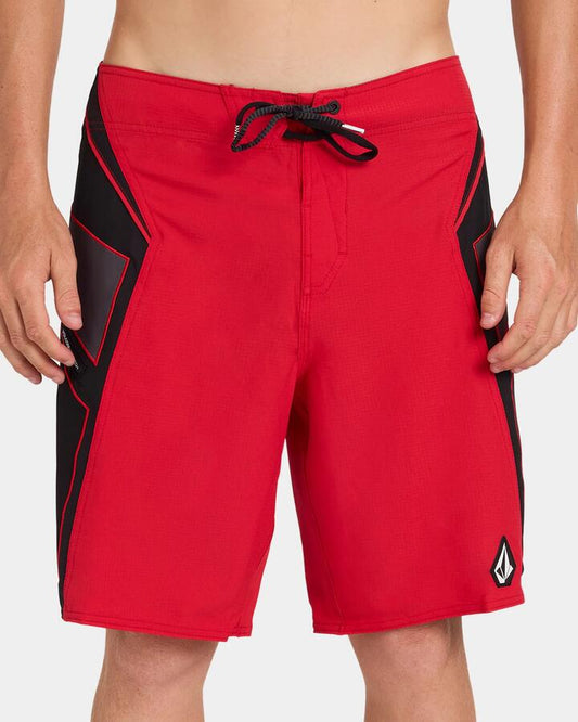 Image of a model wearing Shorts. Product name - Volcom Mens Team Mod 20" Boardshort Ribbon Red in Ribbon Red colour by brand - Volcom