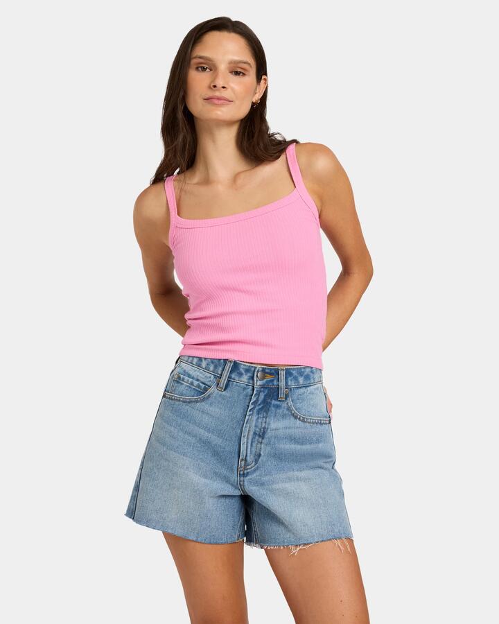 Image of a model wearing Tops. Product name - Nunui Womens Sweet As Tank Pink in Pink colour by brand - Nunui