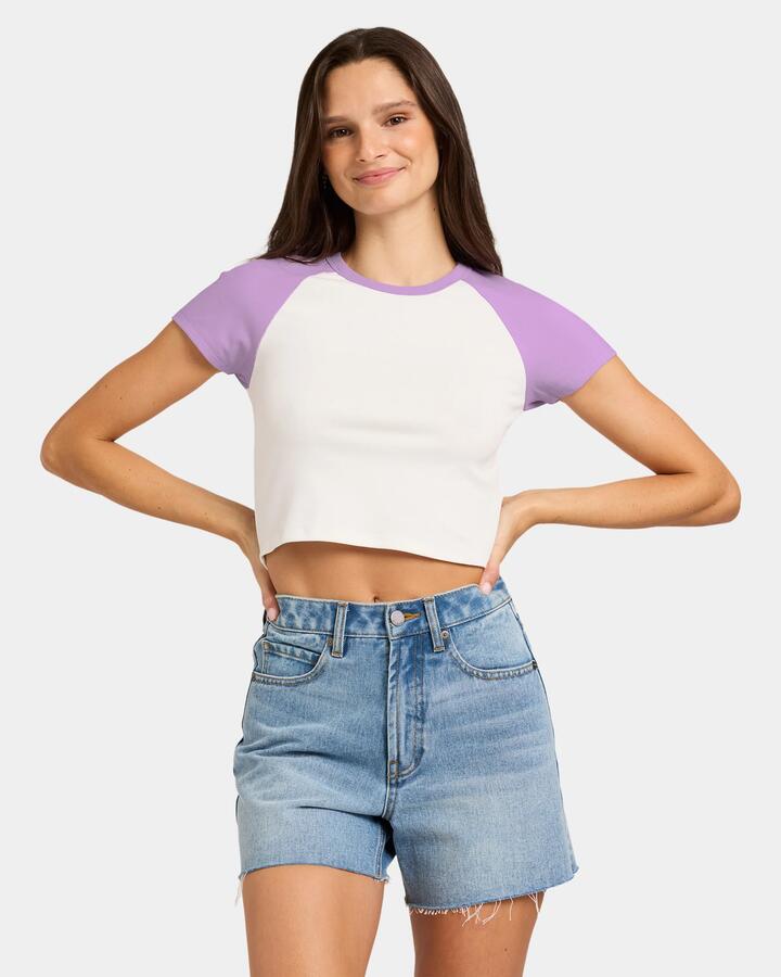 Image of a model wearing Tops. Productname: Nunui Womens Tempest Raglan T-Shirt Lilac - in Lilac colour by brand - Nunui