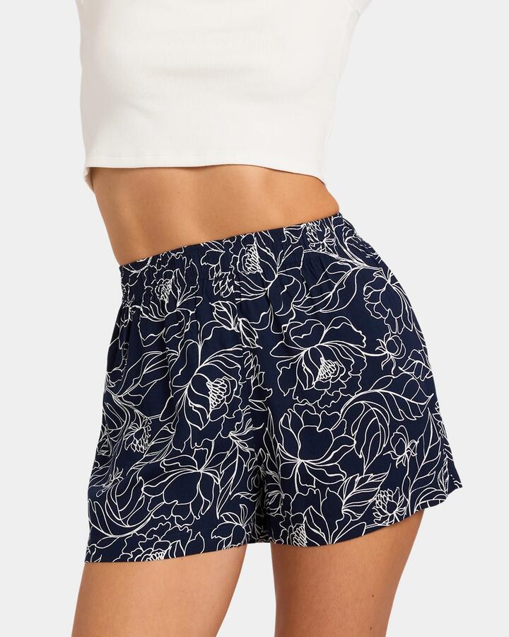 Image of a model wearing Shorts. Product name - Nunui Womens Jardin Shorts Navy in Navy colour by brand - Nunui