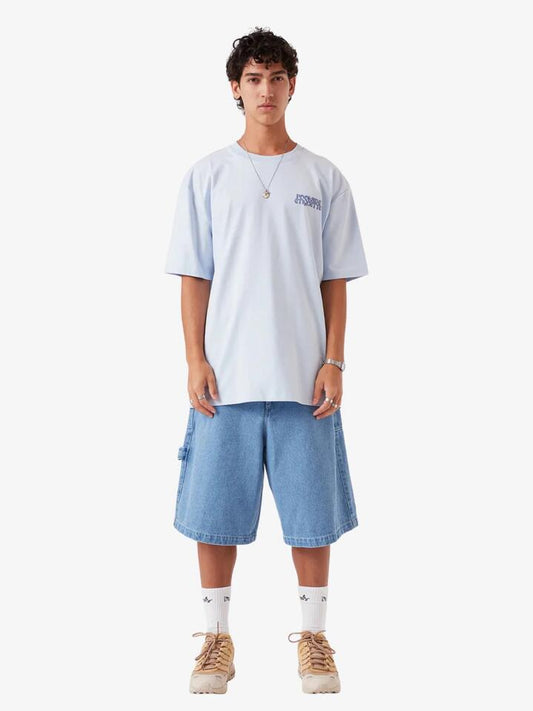 Image of a model wearing Tops. Productname: Barney Cools Legacy Tee in Sky colour by brand - Barney Cools