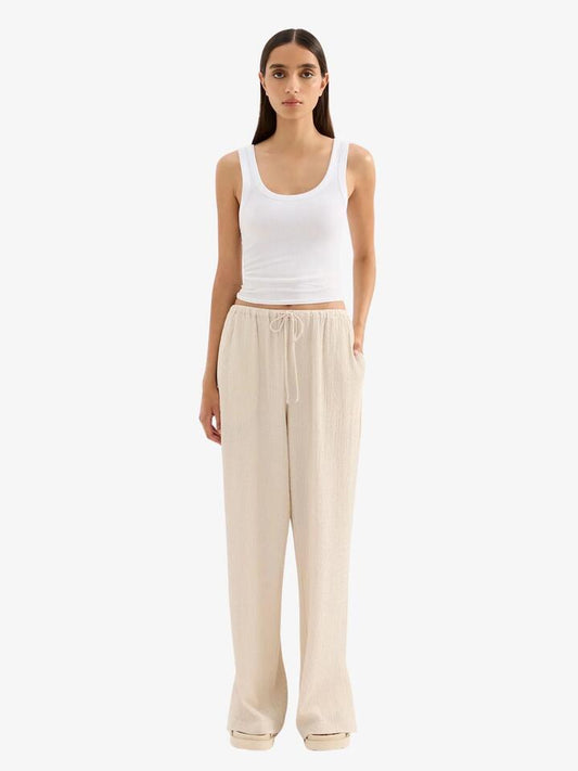 Image of a model wearing Pants. Productname: Nude Lucy Palma Pants in Cream colour by brand - Nude Lucy