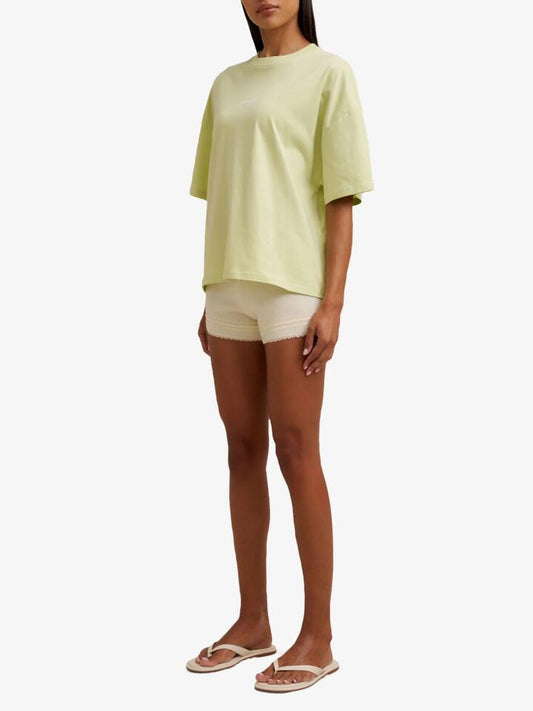 Image of a model wearing Tops. Productname: Doucette Unisex Lime Lover Compact Tee in Lime Green colour by brand - Doucette