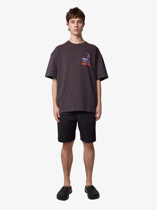 Image of a model wearing Tops. Productname: Deus Under The Pump Tee in Anthracite colour by brand - Deus