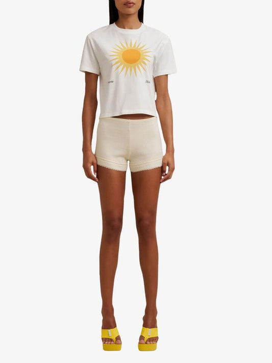 Image of a model wearing Tops. Productname: Doucette Ooo Baby Tee in Ivory colour by brand - Doucette