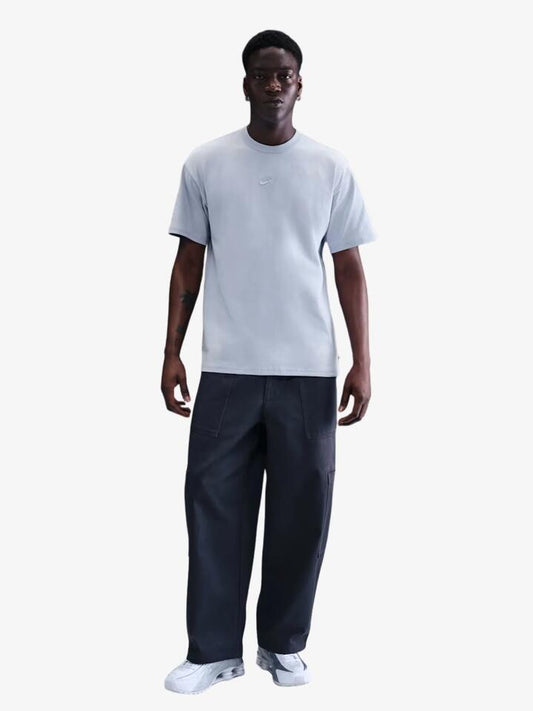 Image of a model wearing Tops. Productname: Nike Men's Nike Sportswear Premium Essentials T-Shirt in Ghost colour by brand - Nike