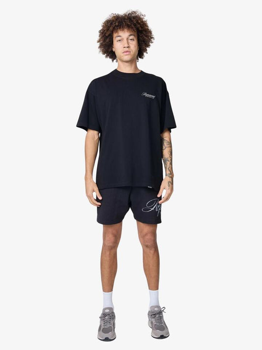 Image of a model wearing Tops. Productname: Represent Represent Owners Club Script T-Shirt in Black colour by brand - Represent