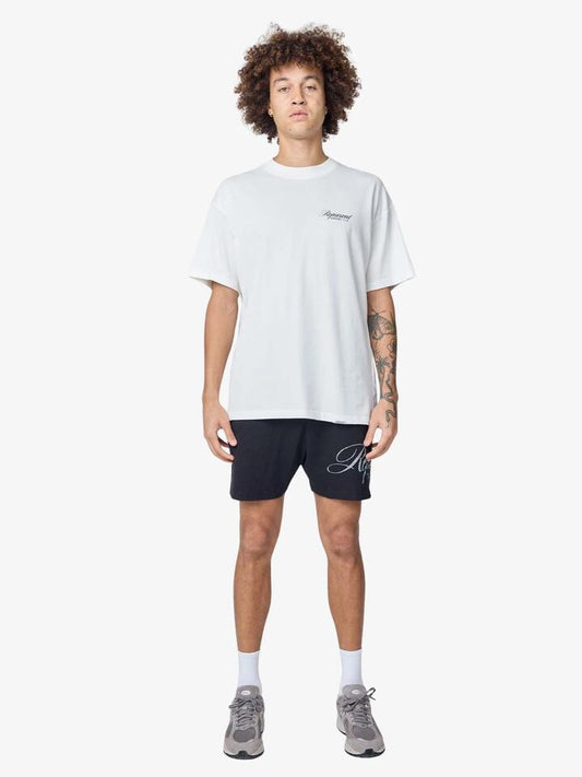 Image of a model wearing Tops. Productname: Represent Represent Owners Club Script T-Shirt in Flat White colour by brand - Represent