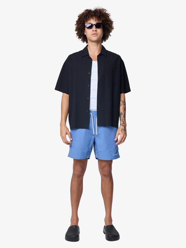 Image of a model wearing Shorts. Productname: G-Star Dirik Solid Swim Shorts in Dutch Blue Gd colour by brand - G-Star