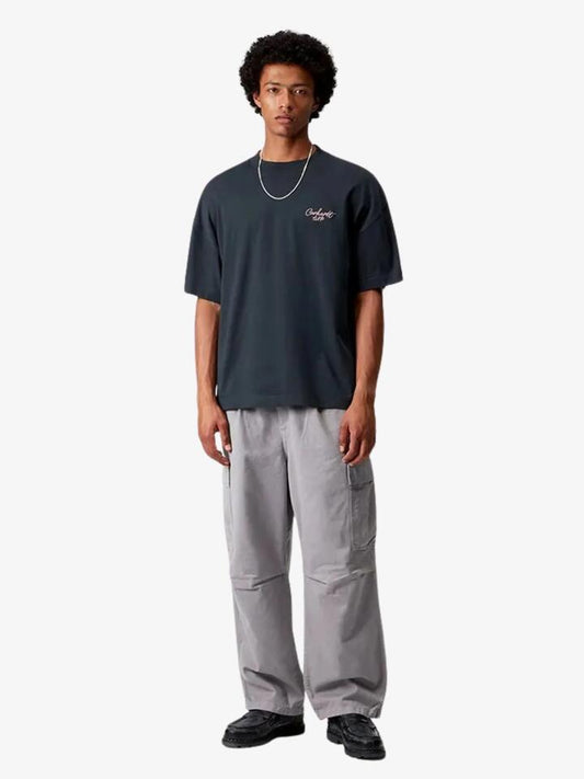 Image of a model wearing Shorts. Productname: Carhartt Wip Short Sleeve Signature Script T-Shirt in Deep Night/Glassy Pink colour by brand - Carhartt Wip