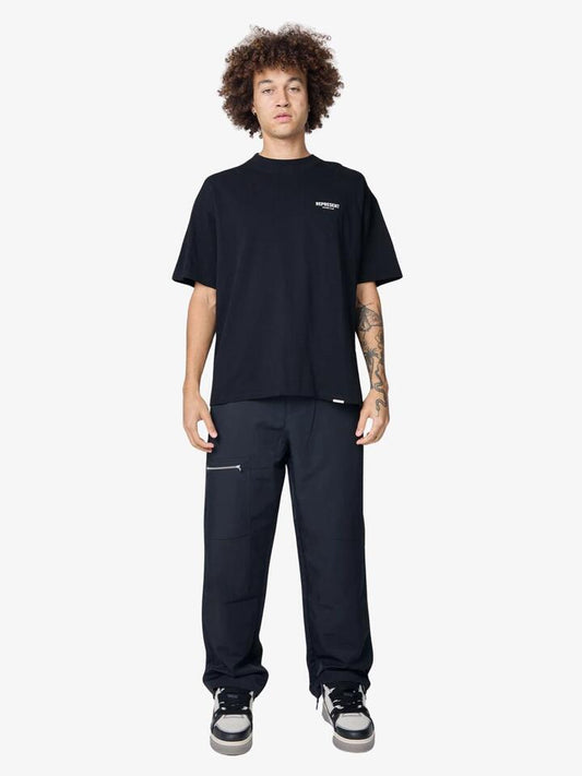 Image of a model wearing Tops. Productname: Represent Represent Owners Club T-Shirt in Black colour by brand - Represent