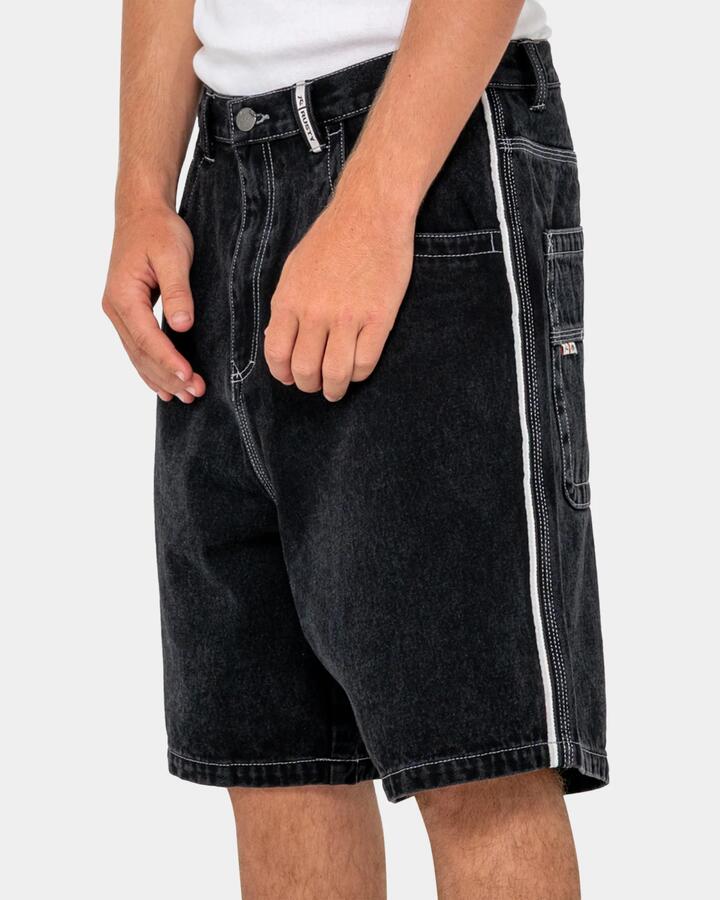 Image of a model wearing Shorts. Productname: rusty Mens Flip Daddy 2.0 Denim Shorts Black - in Black colour by brand - Rusty
