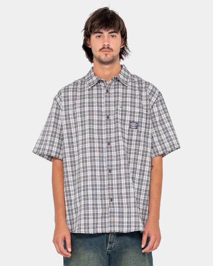 Image of a model wearing Tops. Product name - Rusty Mens Worldwide Short Sleeve Shirt White in White colour by brand - Rusty
