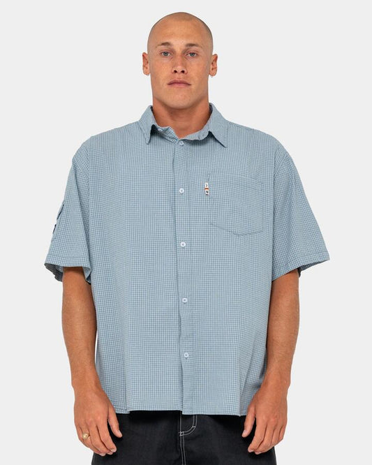 Image of a model wearing Tops. Productname: rusty - Mens Stasha Pocket Short Sleeve Shirt - China Blue - in China Blue colour by brand - rusty