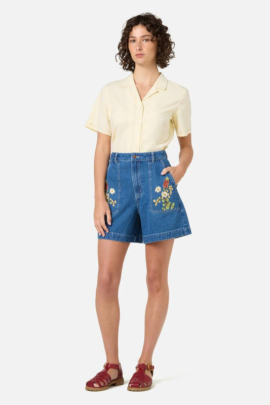 Image of a model wearing Shorts. Productname: Native Flora Embroidered Short in Blue Denim colour by brand - Princess Highway