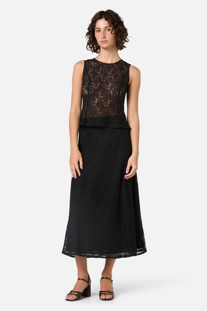 Image of a model wearing Skirts. Productname: Amara Lace Midi Skirt in Black colour by brand - Princess Highway