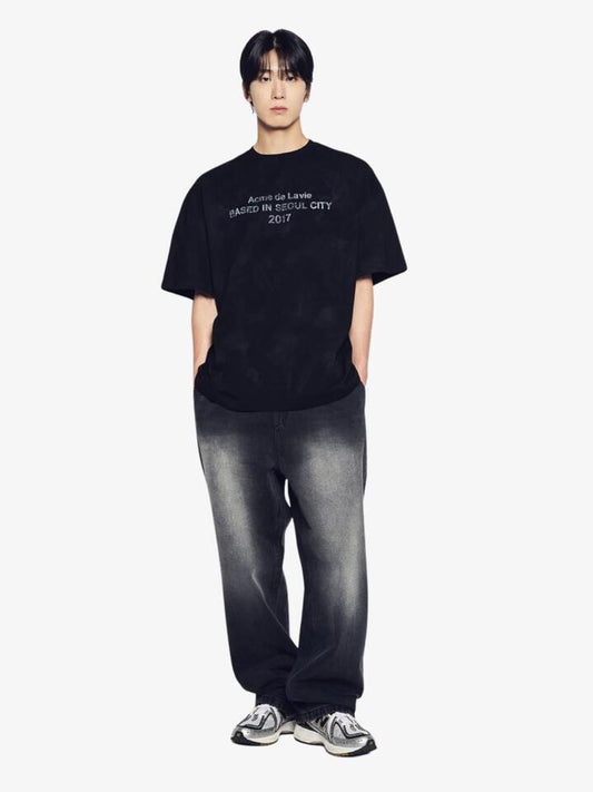 Image of a model wearing Tops. Productname: ADLV Dirty Washed Short Sleeve T-Shirt in Black colour by brand - ADLV